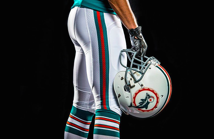 detail showing a Miami Dolphins throwback helmet and uniform pants