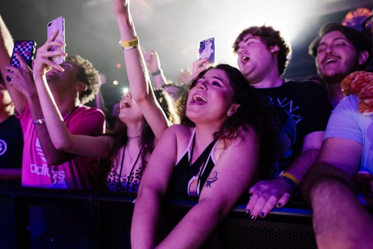 Fans cheering from the front row at the Fillmore Miami Beach