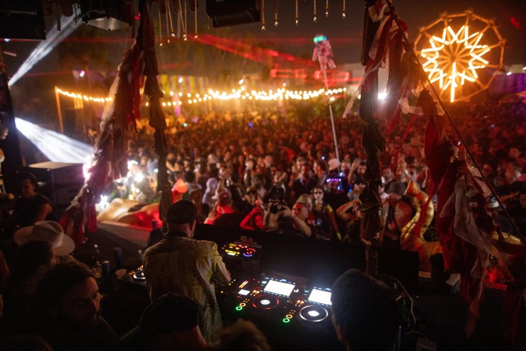 DJ spinning before a massive crowd