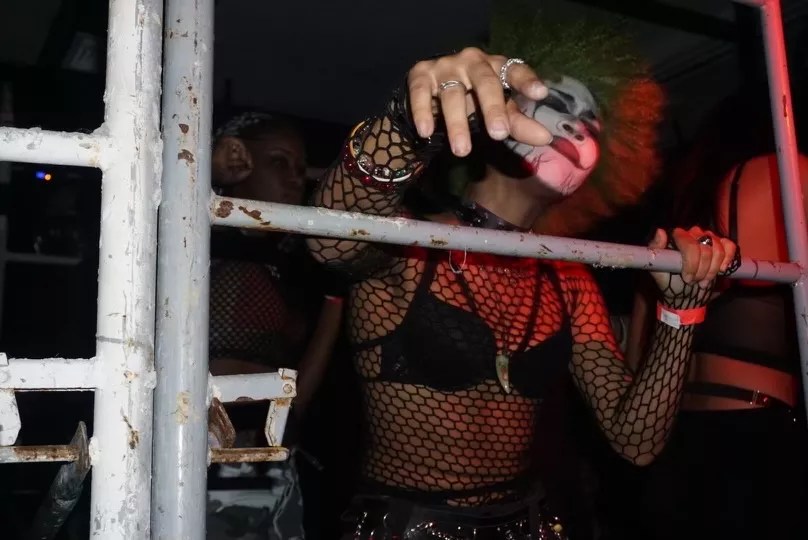 A woman in clown makeup dancing