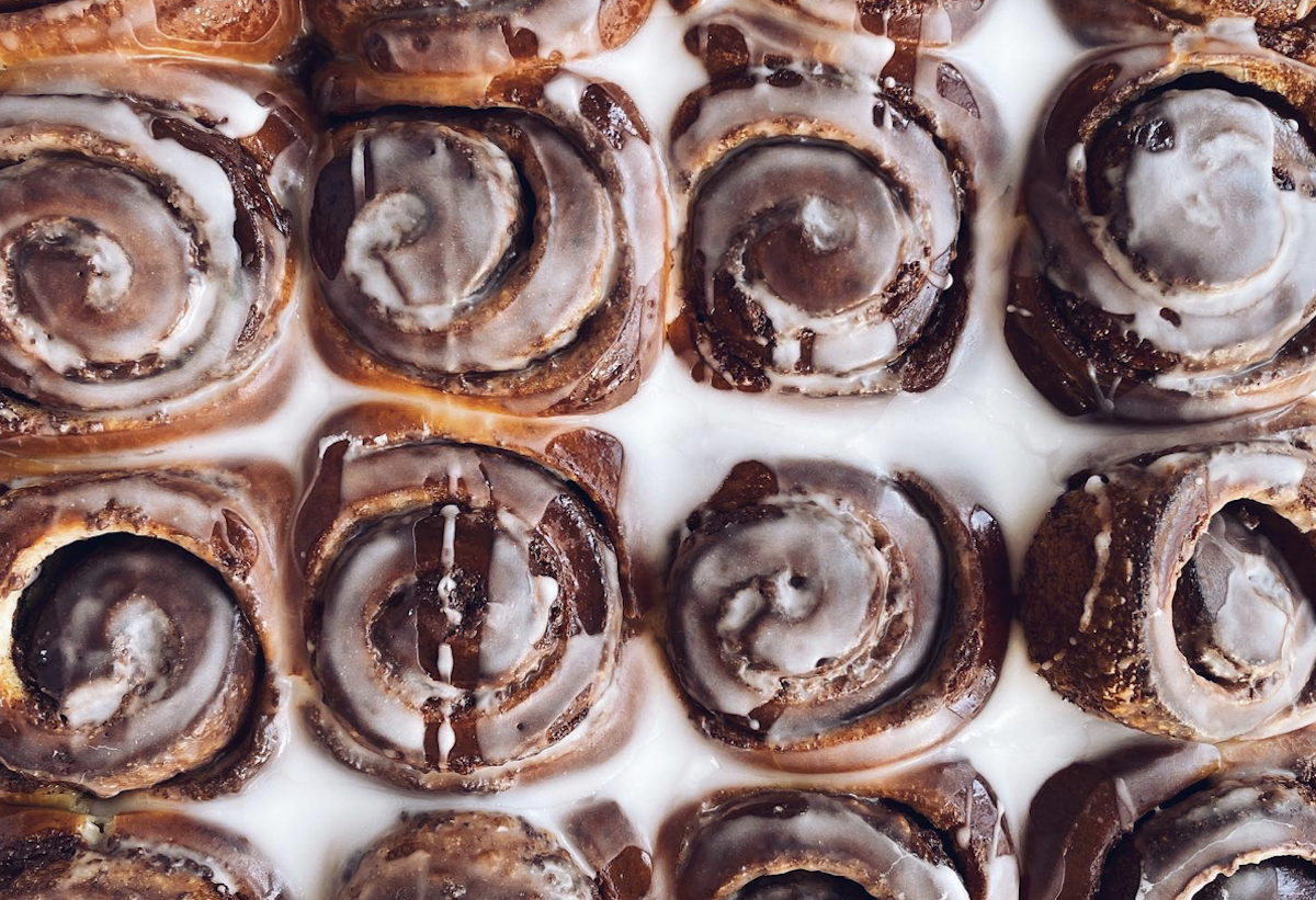 Cinnamon rolls drizzle with glaze at Zak the Baker
