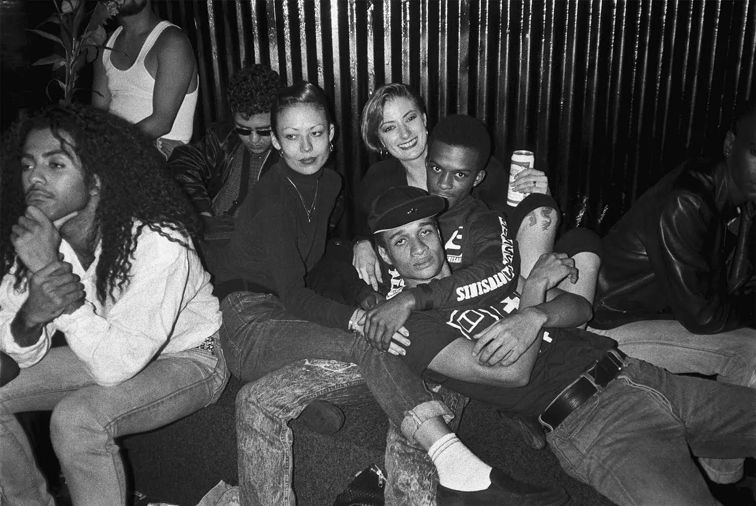 Partygoers staring at the camera on the closing night of Paradise Garage in New York City in 1987.