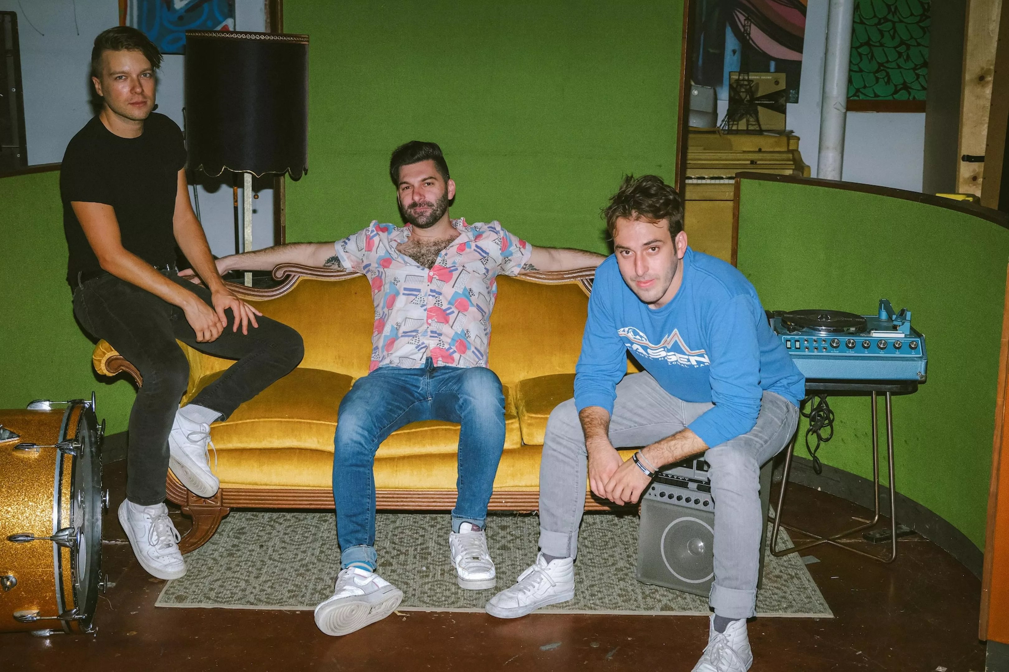 The members of the Magic City Hippies sitting on a couch