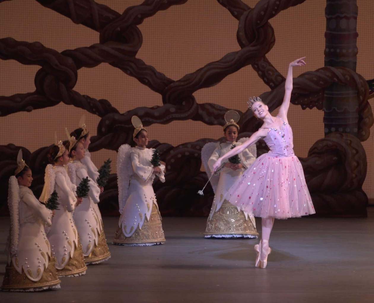 Miami City Ballet principal dancer Dawn Atkins dancing in The Nutcracker, surrounded by young dancers dressed as angels