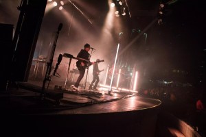 Queens of the Stone Age performing on stage at FPL Solar Amphitheater
