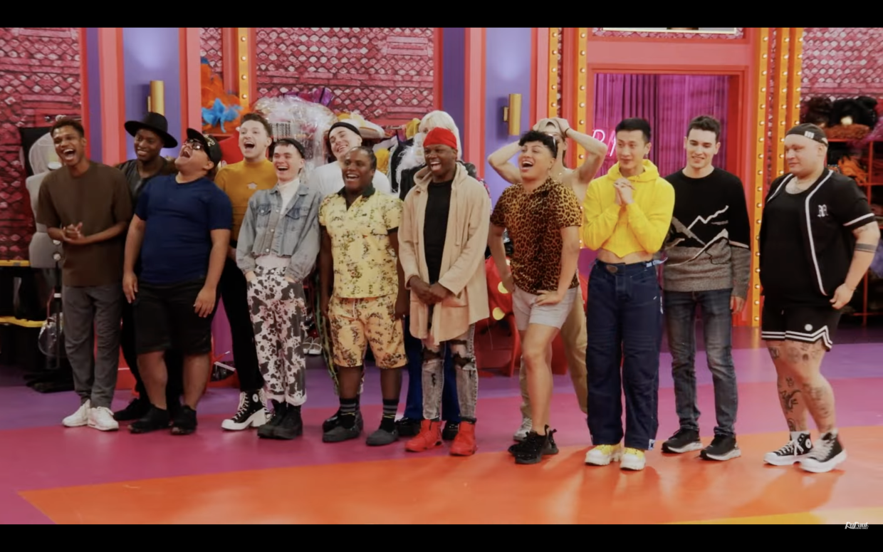The cast of RuPaul's Drag Race stand in the Werk Room outside of drag