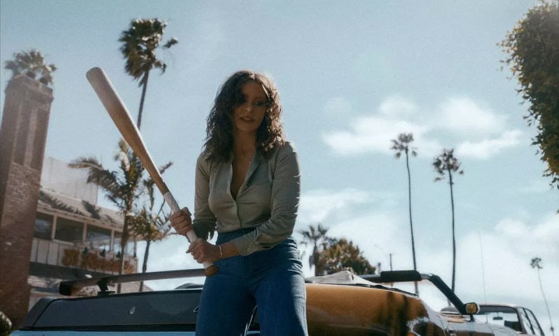 Sofia Vergara's character in Griselda wields a baseball bat — with California palm trees in the background