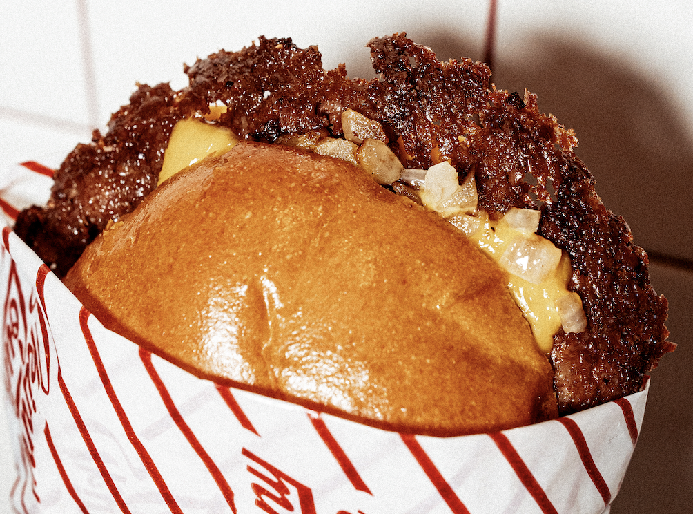 A smash burger with onions