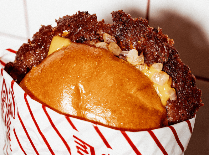 A smash burger with onions