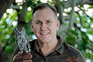 Portrait of Christoper Boykin hold a small owl