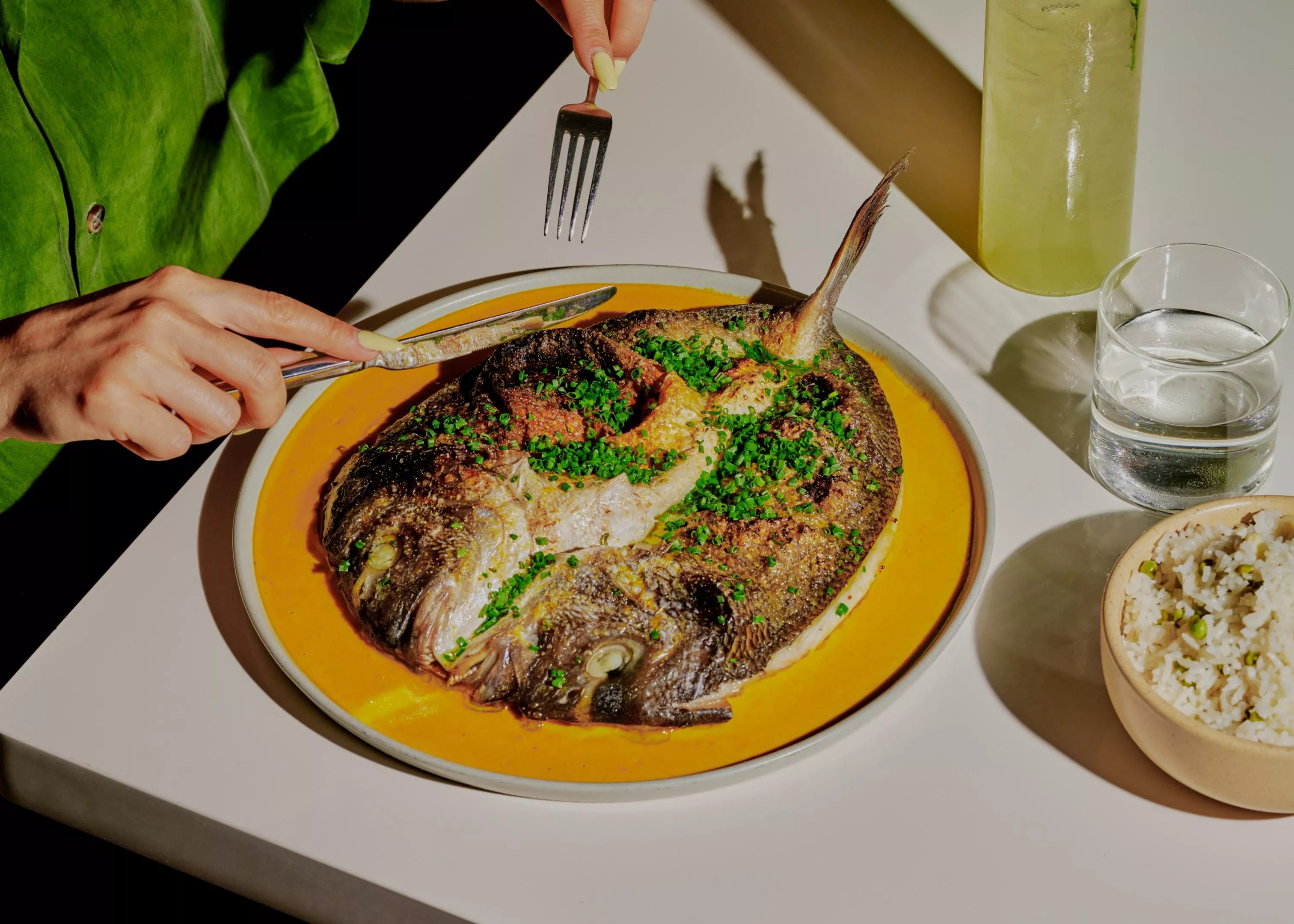 A fish dish on a yellow plate