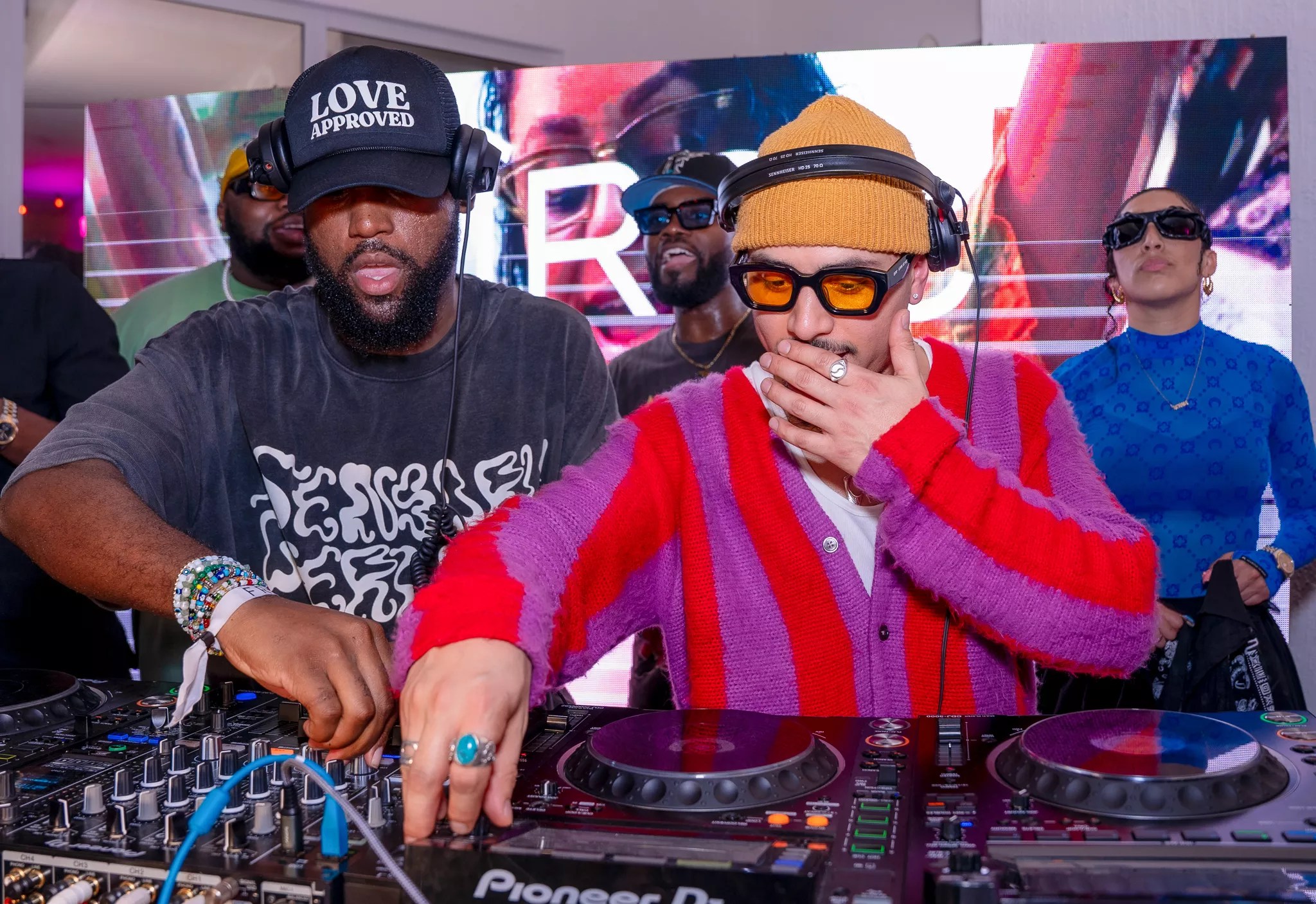 Leslie "Aya" Ayafor and Joe Kay DJing in front of the decks