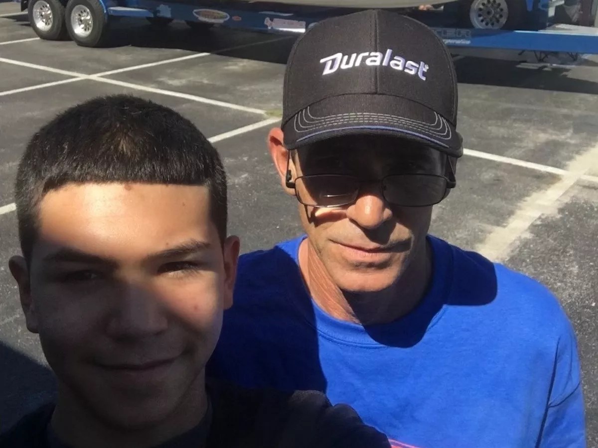 Osvaldo Cueli and his son posing for a photo