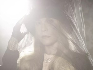Stevie Nicks wearing a hat and veil