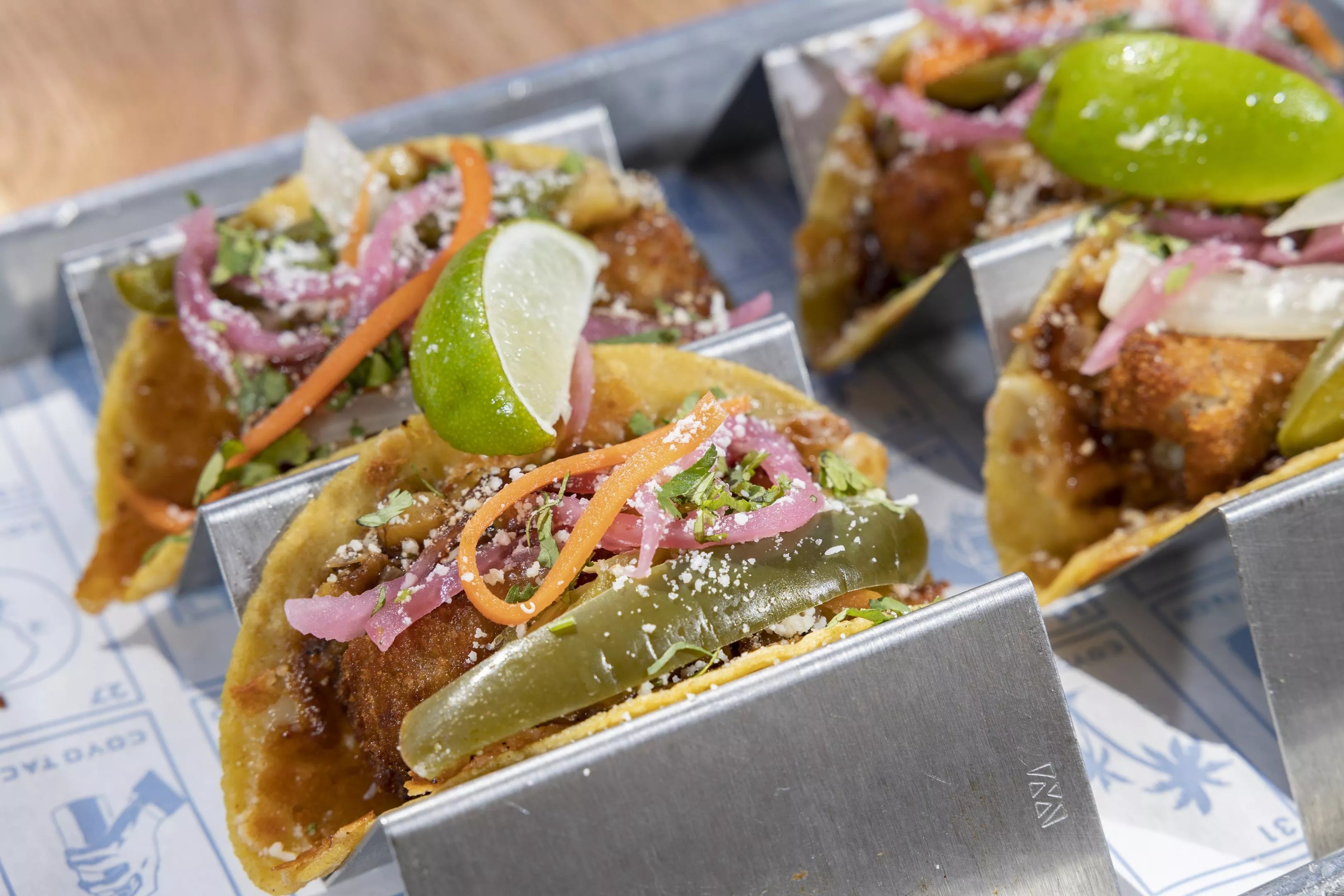 Tacos with toppings in a tray