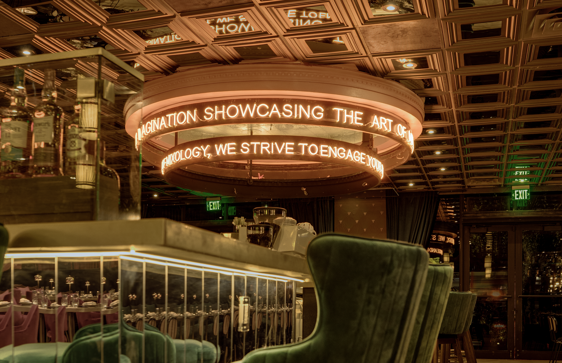 A moody bar by a chandelier