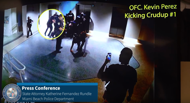 Miami Beach police officer Kevin Perez kicks Dalonta Crudup