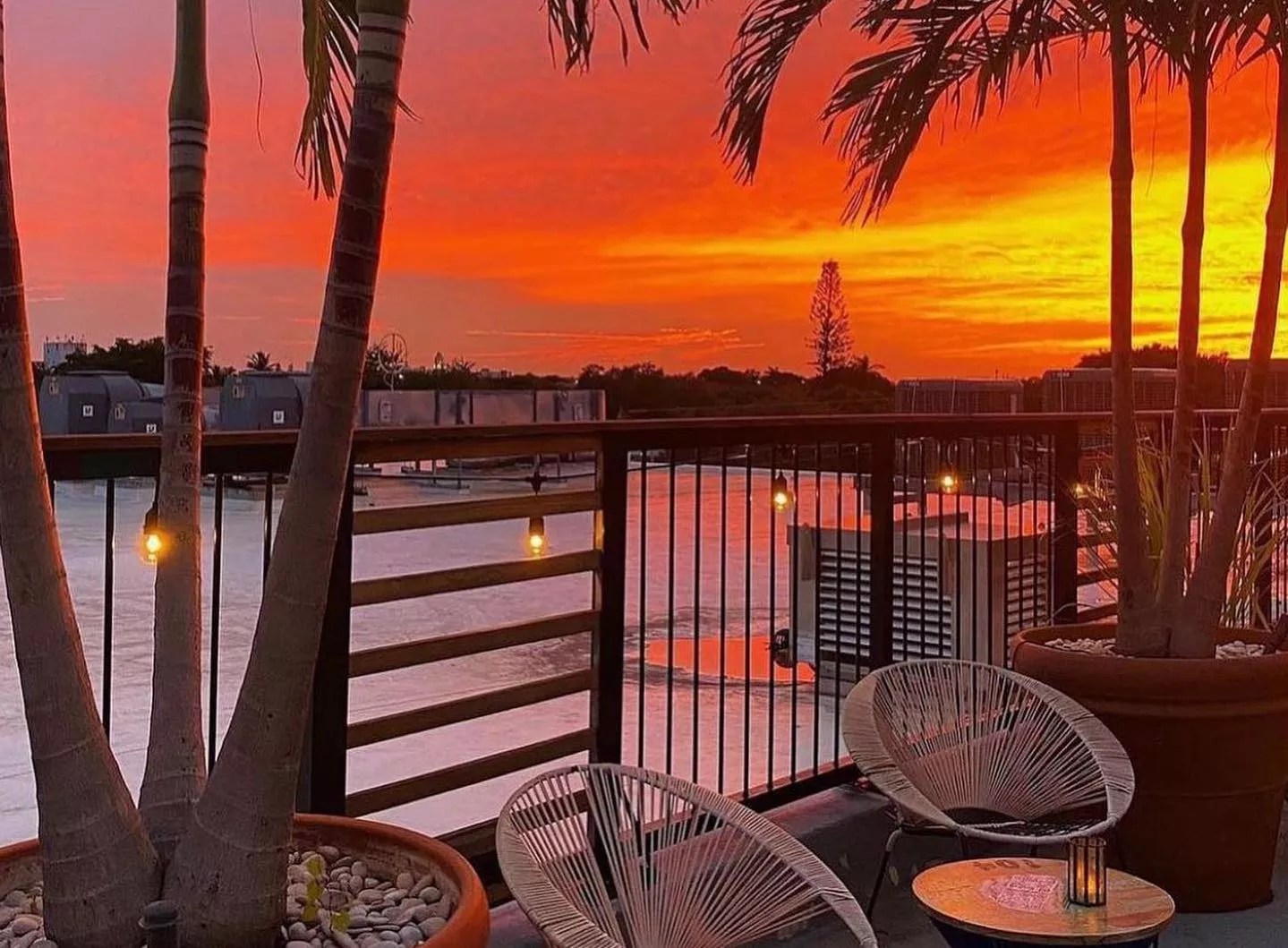 A sunset over a balcony