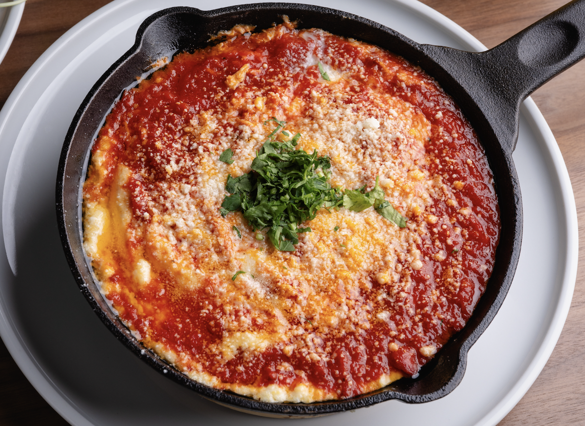 Bar Luca's Eggs in Purgatory served in a cast-iron pan
