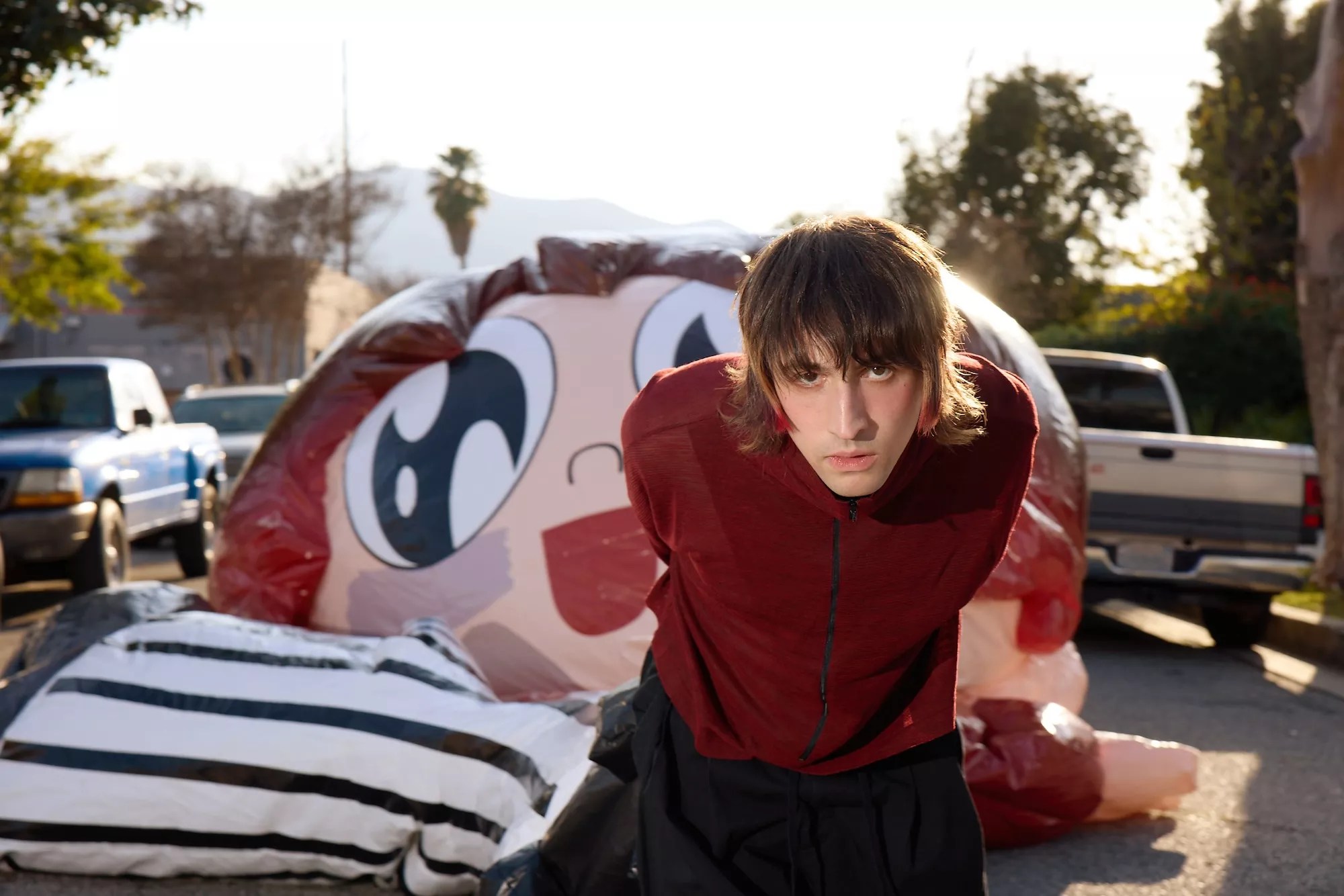 Portrait of Porter Robinson in a red jacket
