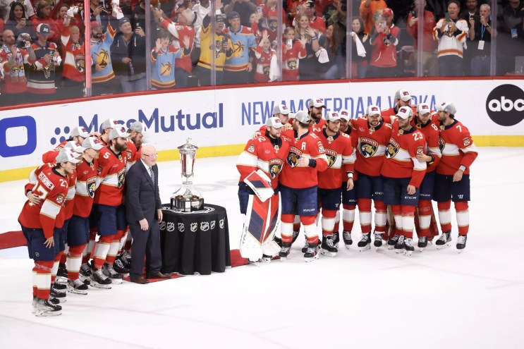 The Florida Panthers gather shoulder-to-shoulder and celebrate on the ice after winning the 2024 Eastern Conference Finals
