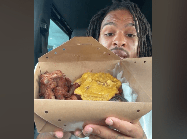 Keith Lee eating out of cardboard box