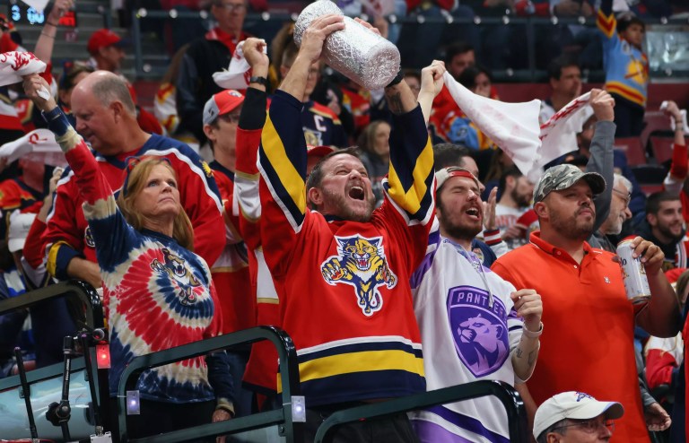 Florida Panthers fans celebrate in the stands of a Stanley Cup Finals game.