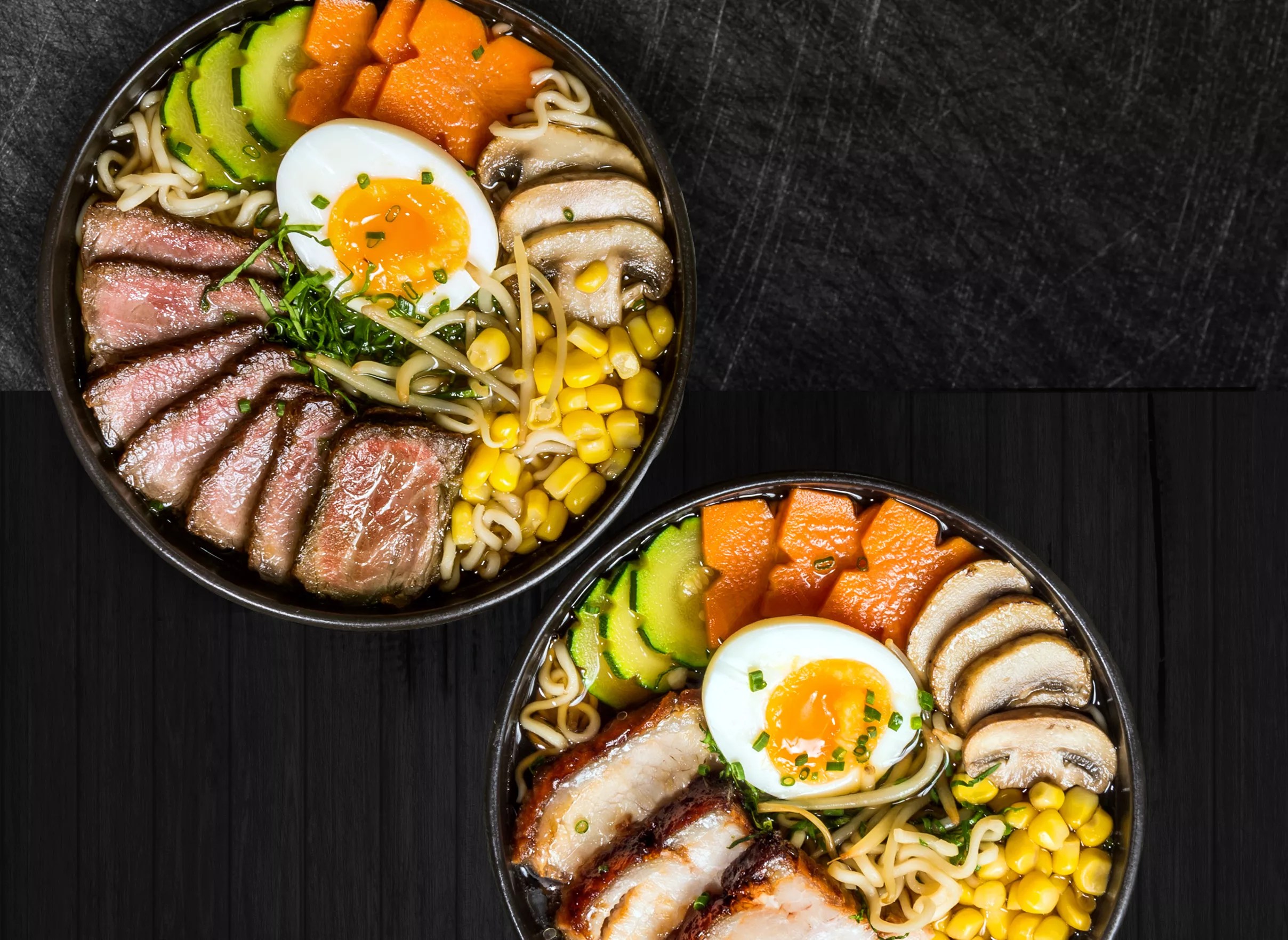 two ramen dishes on a black background