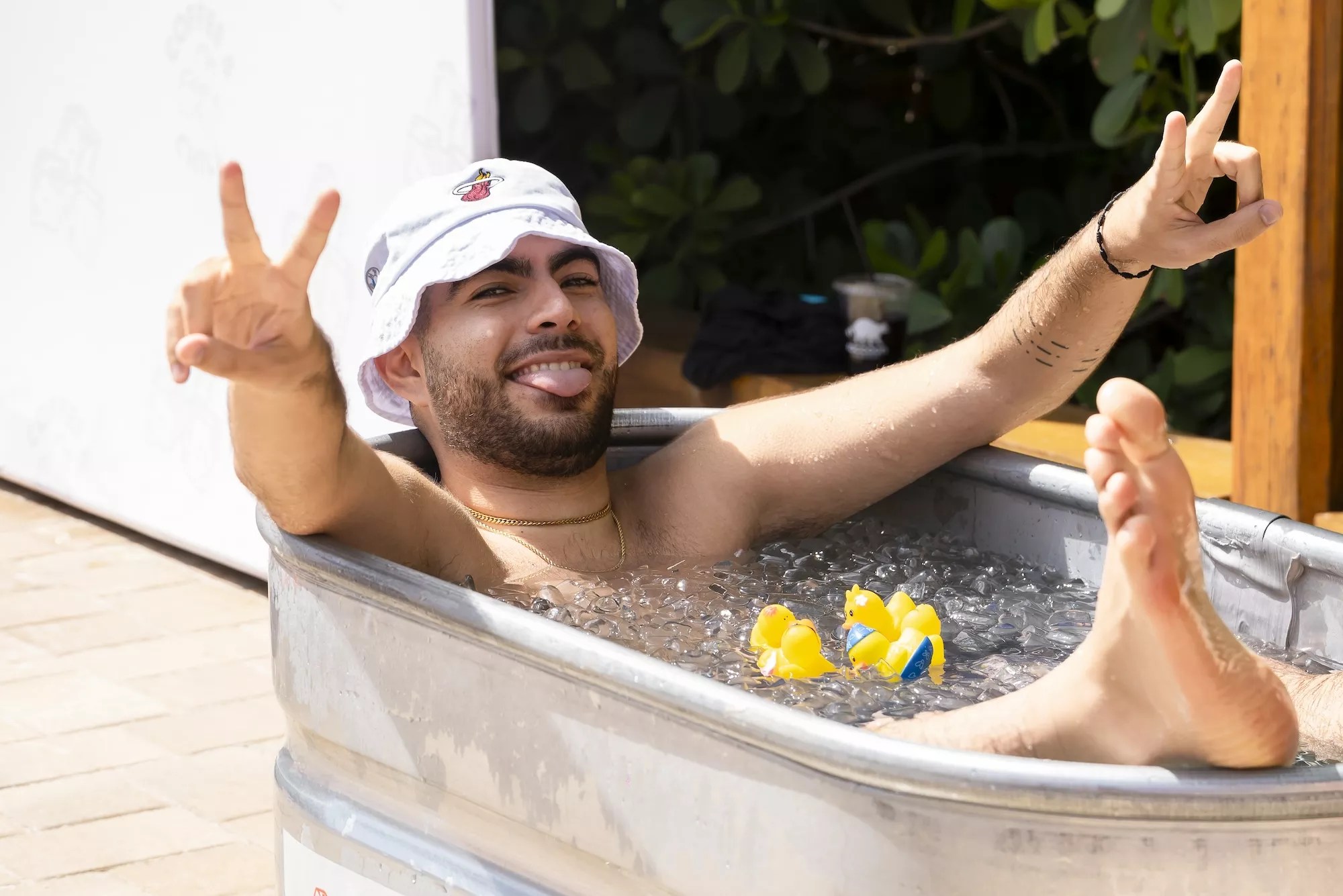 Man in a tub full of water and ice