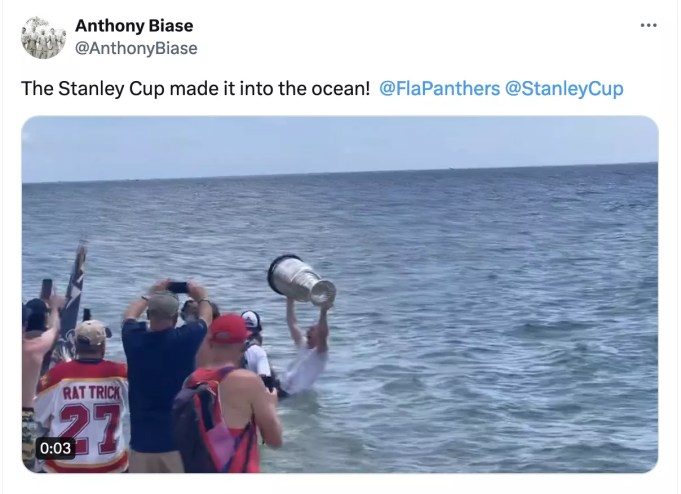 screenshot from a video showing the NHL Stanley Cup getting a dip in the Atlantic Ocean