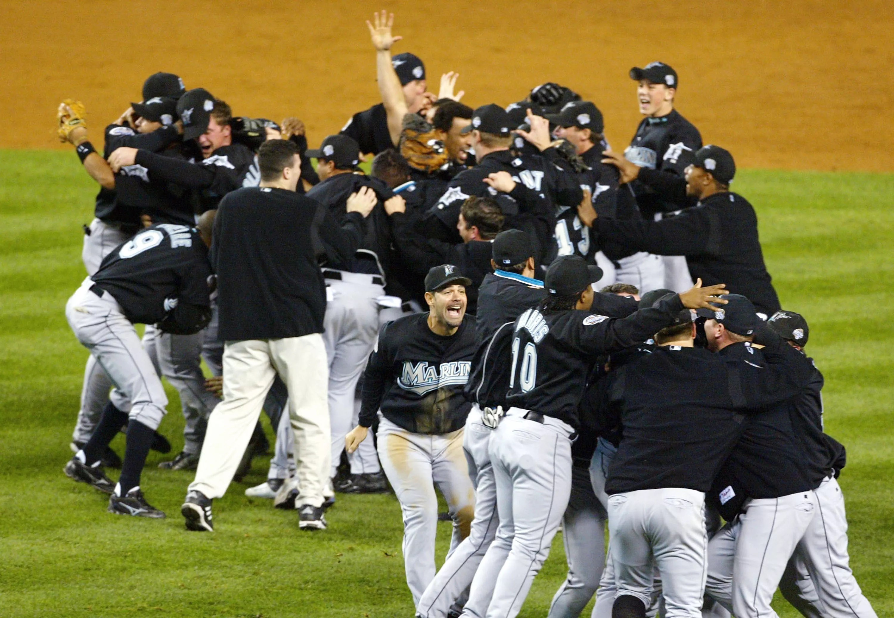 The Florida Marlins celebrate on the infield after winning the 2003 World Series.