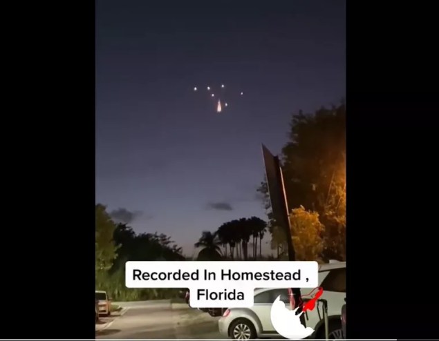 A group of lights break apart and stay suspended in the air over Homestead