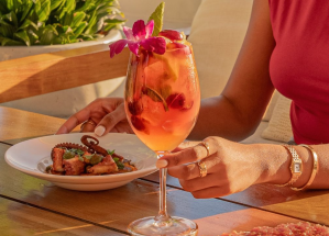 a hand holding a drink