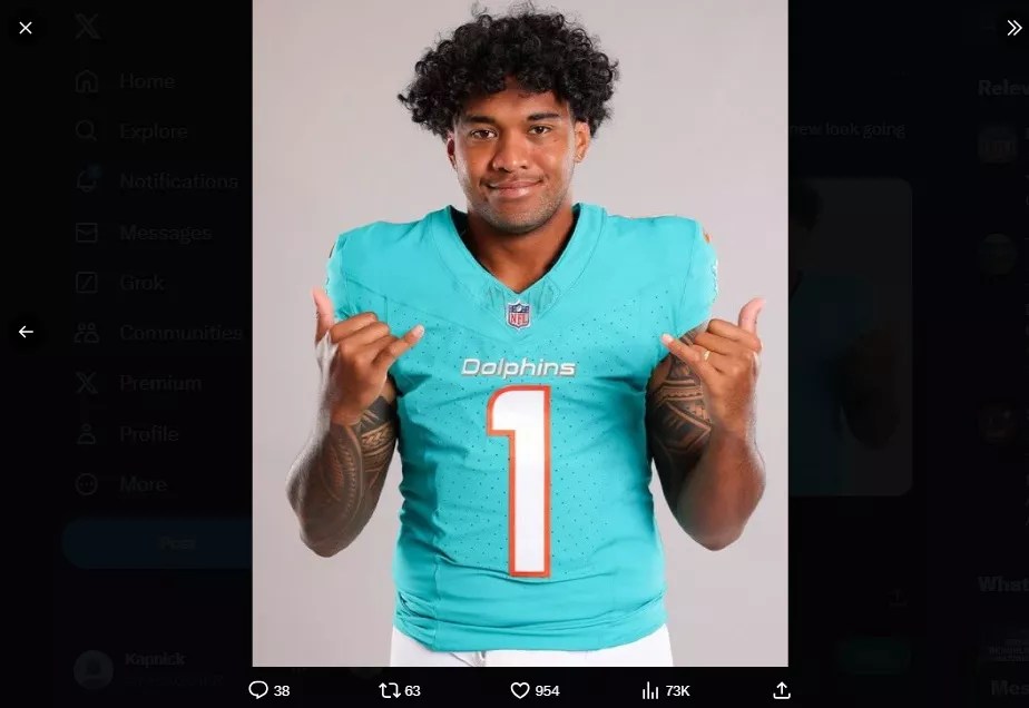 Tua Tagovailoa throws up some shaka signs in uniform