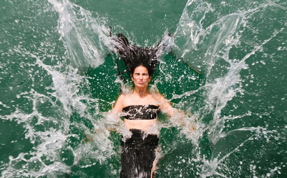 A woman splash into water
