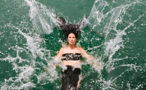 A woman splash into water