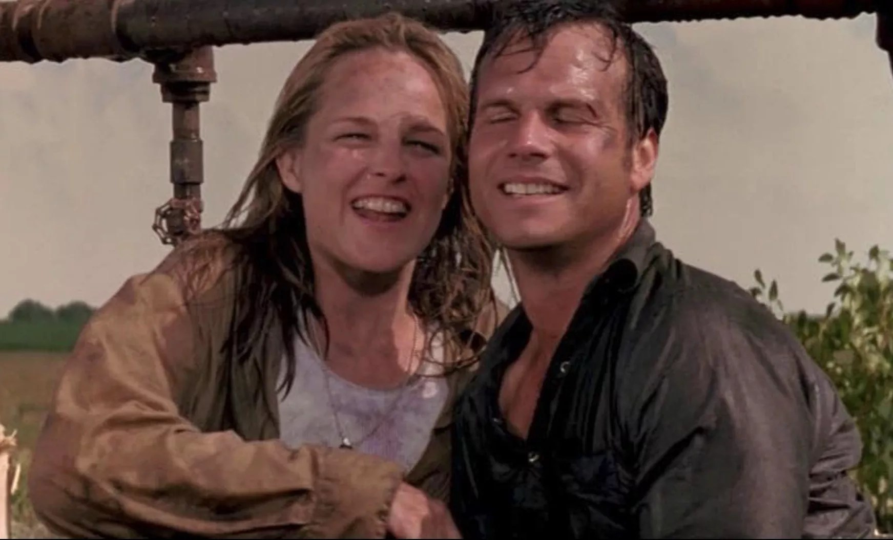 The storm-drenched costars of <i>Twister</i> looking ecstatic at having survived and also very much in love