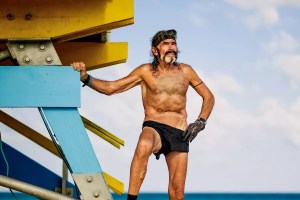 Robert "Raven" Kraft poses next to a lifeguard stand in Miami Beach