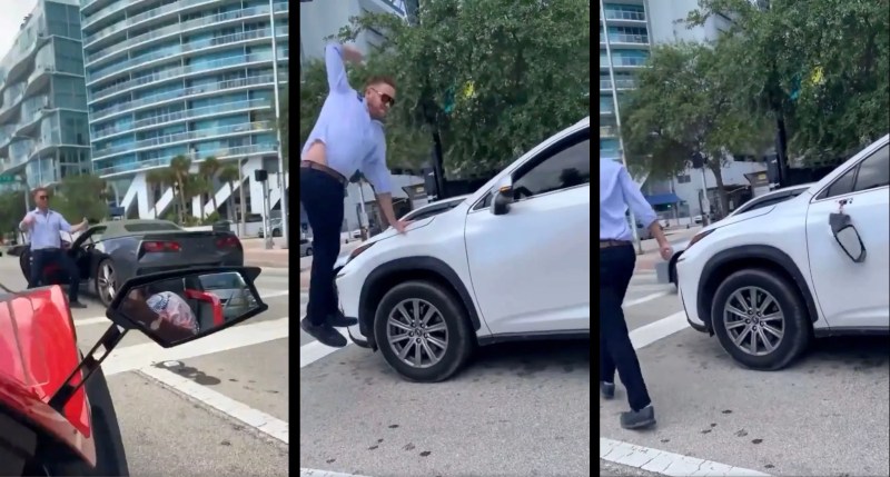 An enraged man leaps into the air in downtown traffic to deliver a hammer fist to an SUV's driver-side mirror