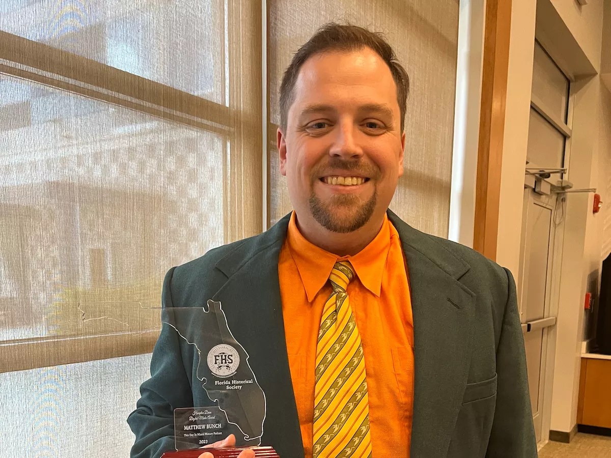 Matthew Bunch holding an award
