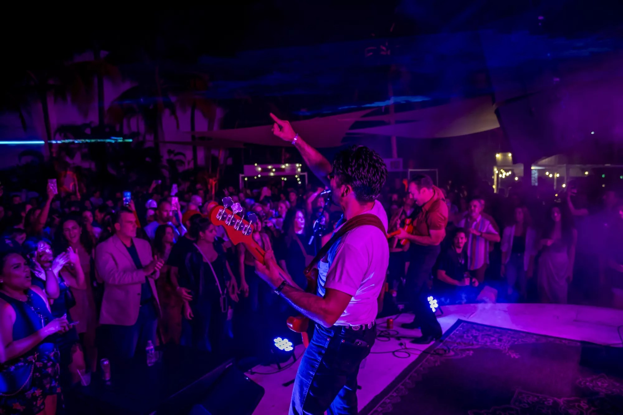 LA LOM performing on stage at ZeyZey in Miami