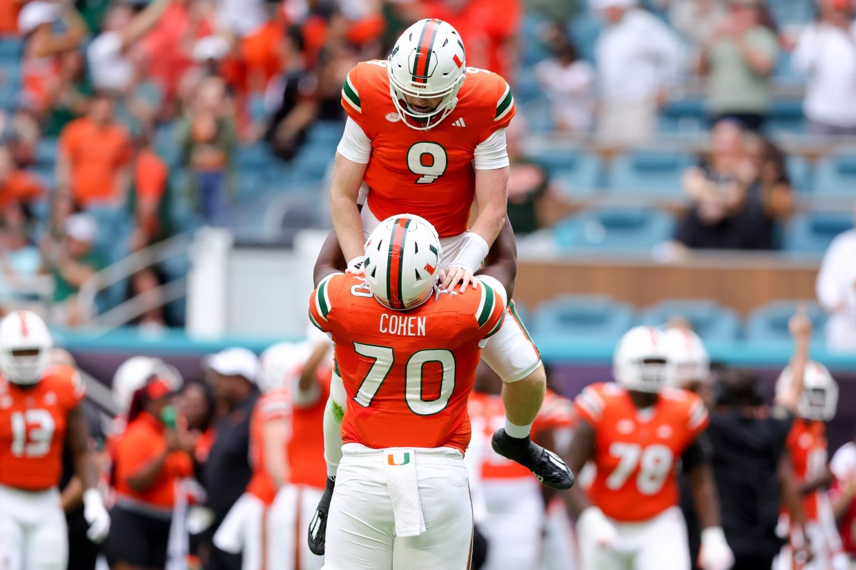 UM players celebrate a touchdown