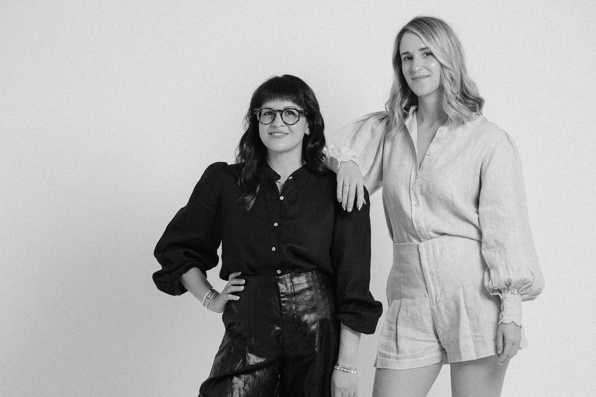 Black-and-white portrait of Melody Santiago Cummings and Caroline Cabrera