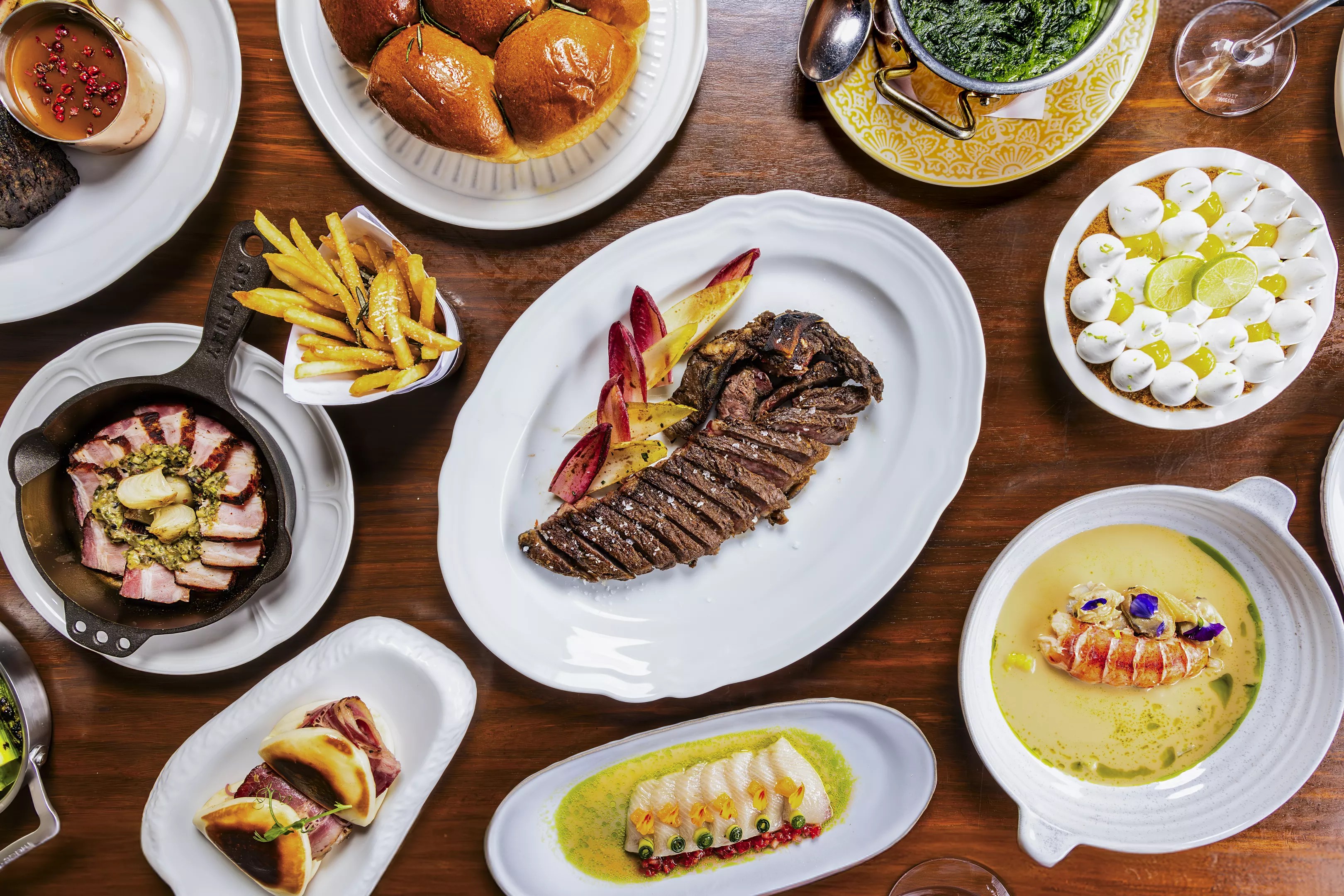 steak and fries on plates