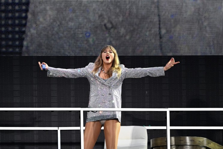 Taylor Swift performing onstage at Wembley Stadium in London