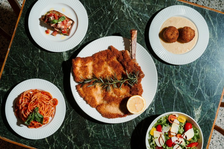 a bunch of dishes on a green table
