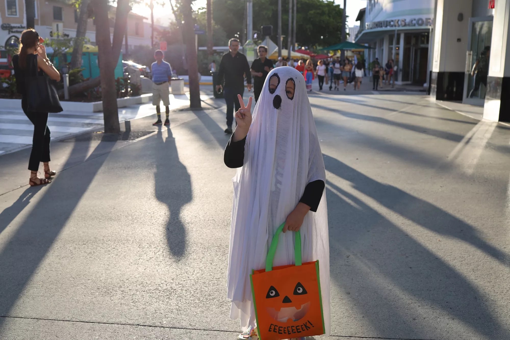 Kid dressed as a ghost on Lincoln Road