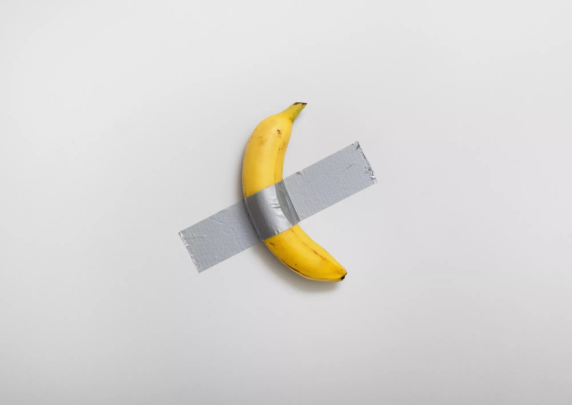 Maurizio Cattelan's Comedian featuring a banana duct-taped to a wall
