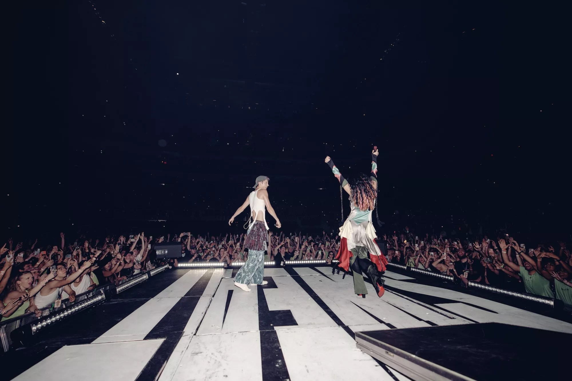 Troye Sivan and Charli XCX onstage at the Kaseya Center in Miami