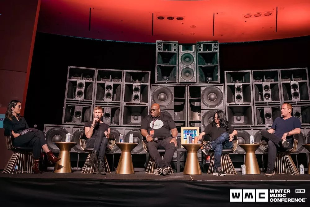 Richie Hawtin, Carl Cox, and others onstage during a panel at Winter Music Conference 2019